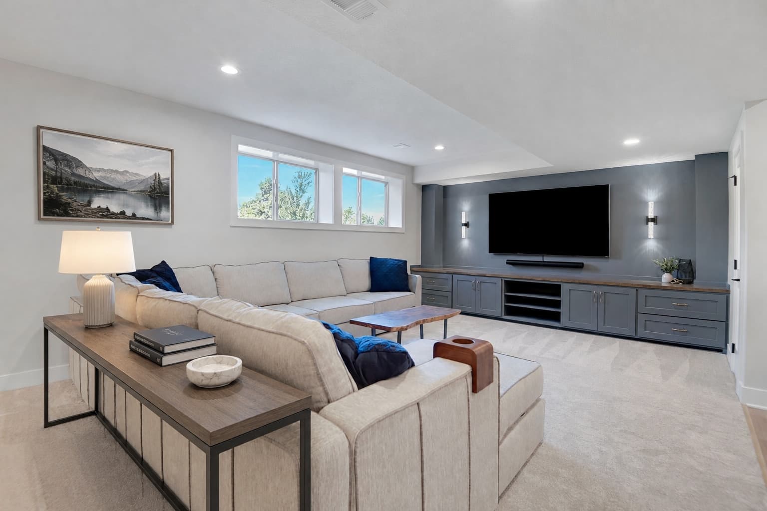 Cream sectional media room with a built-in entertainment wall